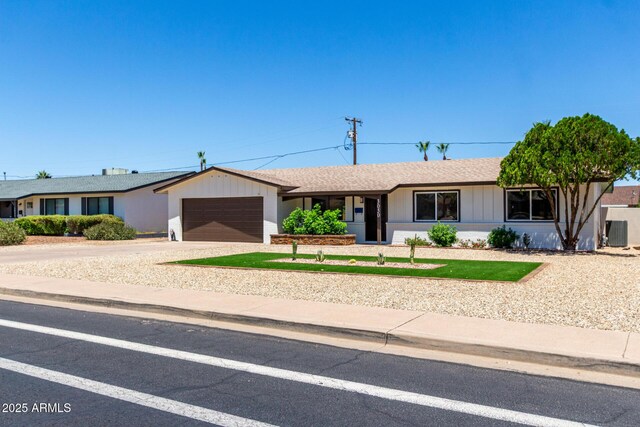 3050 E Cholla St E, Phoenix, AZ 85028 - ranch-style house with driveway, a garage, and a shingled roof