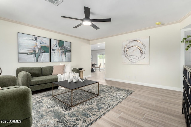 3050 E Cholla St E, Phoenix, AZ 85028 - living area with crown molding, ceiling fan, and wood finished floors