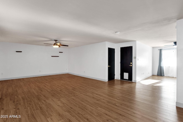 14215 N 36th Way, Phoenix, AZ 85032 - unfurnished living room featuring a ceiling fan, wood finished floors, and baseboards