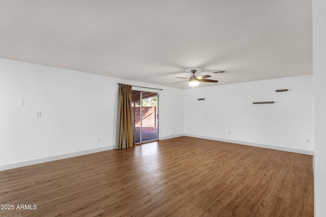 14215 N 36th Way, Phoenix, AZ 85032 - empty room featuring ceiling fan, wood finished floors, and baseboards