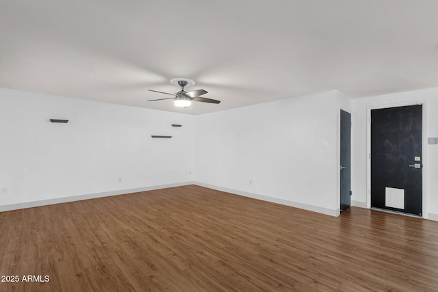 14215 N 36th Way, Phoenix, AZ 85032 - spare room featuring wood finished floors, a ceiling fan, and baseboards