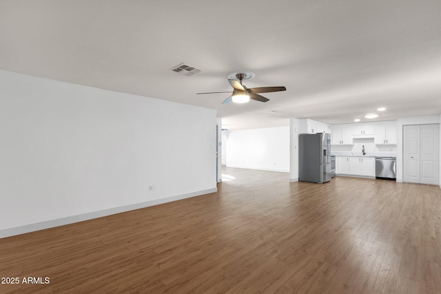 14215 N 36th Way, Phoenix, AZ 85032 - unfurnished living room with a sink, a ceiling fan, wood finished floors, baseboards, and recessed lighting