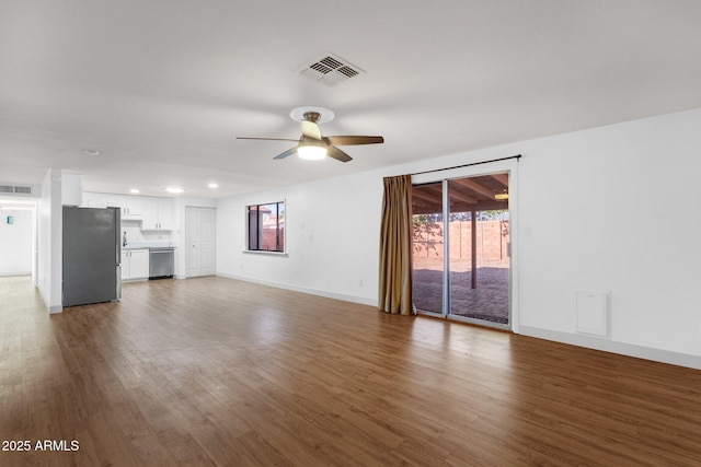 14215 N 36th Way, Phoenix, AZ 85032 - unfurnished living room featuring a ceiling fan, wood finished floors, baseboards, and recessed lighting