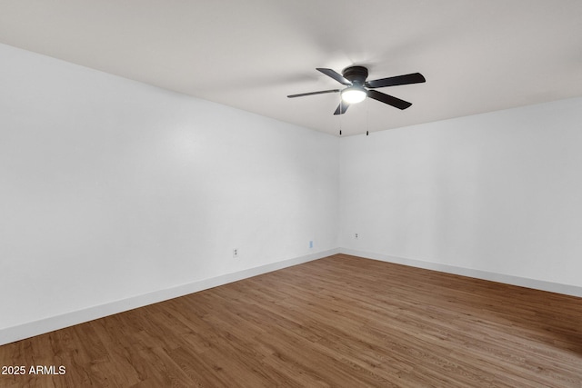14215 N 36th Way, Phoenix, AZ 85032 - empty room with wood finished floors, a ceiling fan, and baseboards