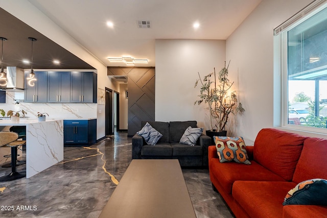 living room featuring recessed lighting