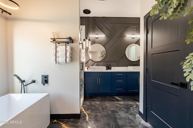 bathroom featuring double vanity, a freestanding bath, baseboards, and finished concrete floors