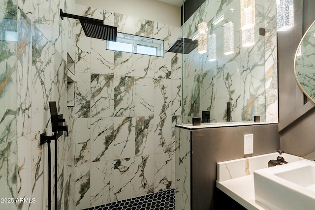 bathroom with a marble finish shower and vanity