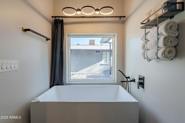 full bathroom with a soaking tub