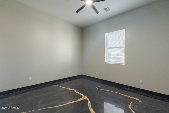 unfurnished room featuring a ceiling fan and baseboards