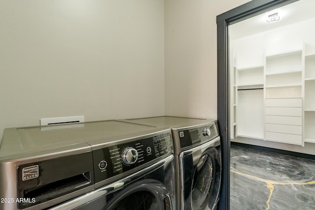 washroom with washing machine and dryer