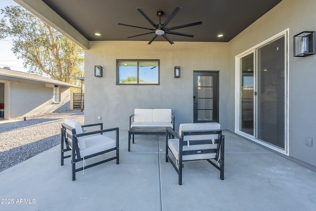 view of patio with outdoor lounge area and ceiling fan