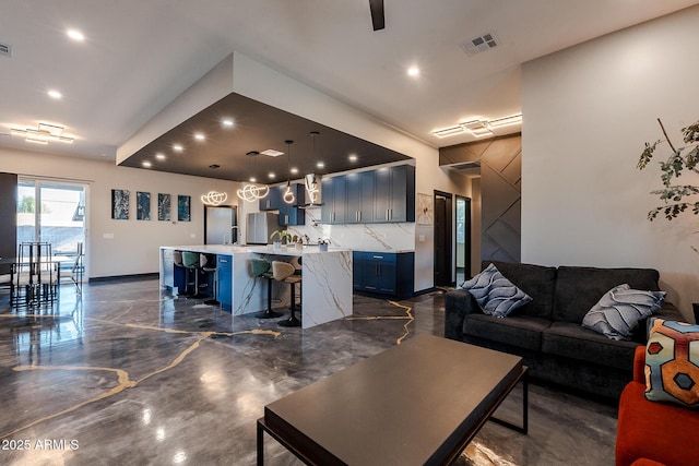 living area with recessed lighting and ceiling fan