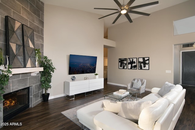 14424 N 64th Pl, Scottsdale, AZ 85254 - living area with wood finished floors, a ceiling fan, a fireplace, baseboards, and high vaulted ceiling
