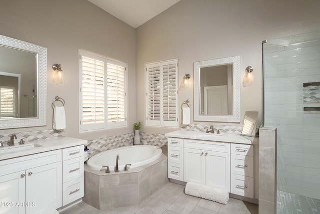 14424 N 64th Pl, Scottsdale, AZ 85254 - bathroom with plenty of natural light, a bath, two vanities, a tile shower, and lofted ceiling