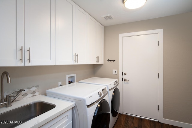 14424 N 64th Pl, Scottsdale, AZ 85254 - clothes washing area featuring cabinet space, independent washer and dryer, dark wood-style floors, and baseboards