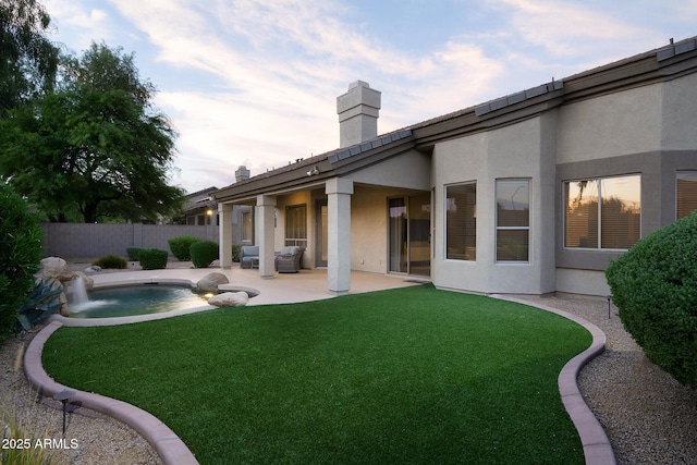 14424 N 64th Pl, Scottsdale, AZ 85254 - back of property with stucco siding, a chimney, and a patio area