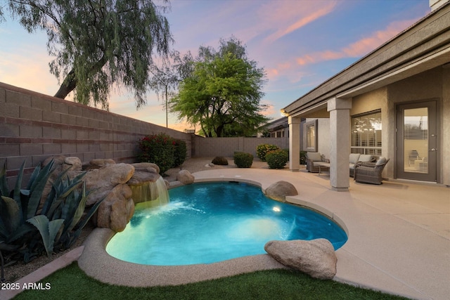 14424 N 64th Pl, Scottsdale, AZ 85254 - pool at dusk featuring a fenced backyard, an outdoor hangout area, and a patio area