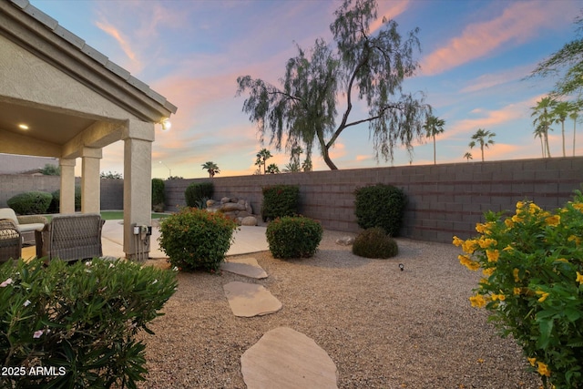 14424 N 64th Pl, Scottsdale, AZ 85254 - yard at dusk featuring a patio and a fenced backyard