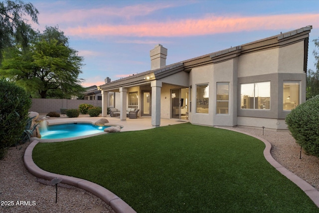 14424 N 64th Pl, Scottsdale, AZ 85254 - back of property with a chimney, a patio area, and stucco siding