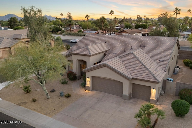 14424 N 64th Pl, Scottsdale, AZ 85254 - view of front of property featuring a garage, stucco siding, driveway, a tiled roof, and fence