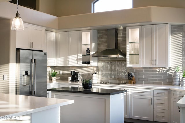 14424 N 64th Pl, Scottsdale, AZ 85254 - kitchen featuring high end refrigerator, wall chimney exhaust hood, black electric stovetop, white cabinets, and decorative backsplash