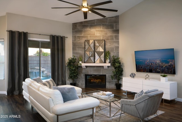 14424 N 64th Pl, Scottsdale, AZ 85254 - living area with vaulted ceiling, a ceiling fan, wood finished floors, a fireplace, and baseboards