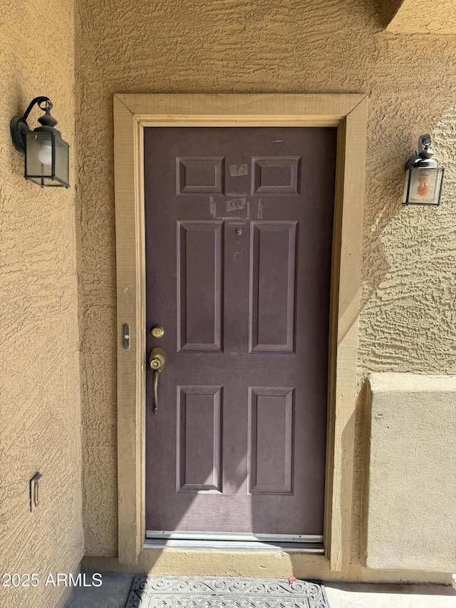 9456 W Jamestown Rd, Phoenix, AZ 85037 - doorway to property with stucco siding