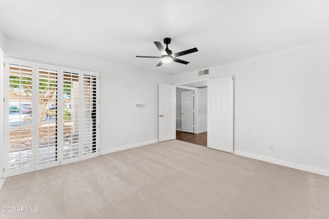 unfurnished bedroom featuring visible vents, baseboards, ceiling fan, and carpet flooring