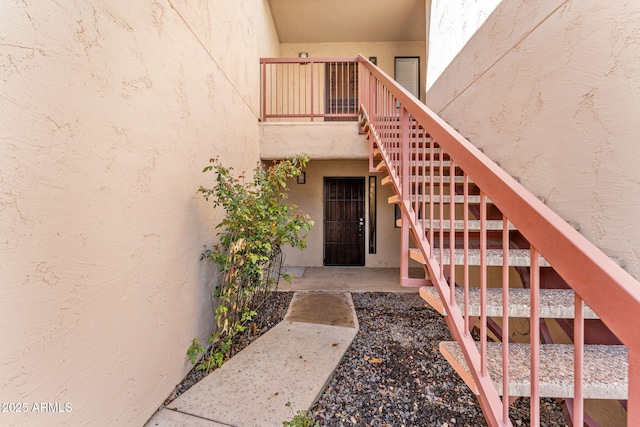 doorway to property with stucco siding