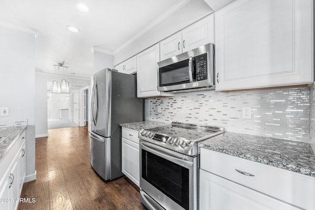 kitchen featuring ornamental molding, tasteful backsplash, dark wood-style floors, stainless steel appliances, and white cabinets