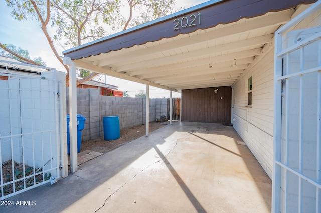 view of parking / parking lot featuring a carport