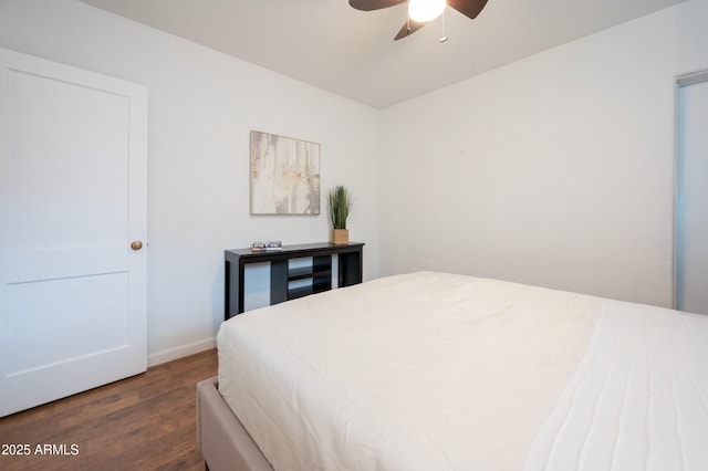 bedroom with ceiling fan and dark wood-type flooring