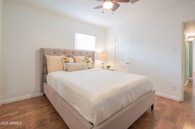 bedroom featuring ceiling fan and dark wood-type flooring