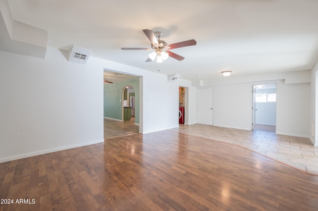 unfurnished room featuring ceiling fan and hardwood / wood-style floors