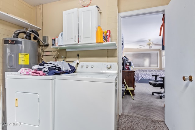 washroom featuring water heater, carpet floors, separate washer and dryer, ceiling fan, and cabinets