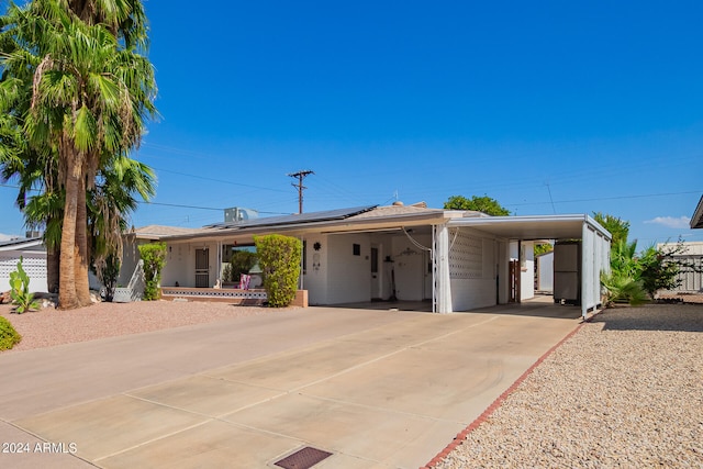 view of front of property with a carport