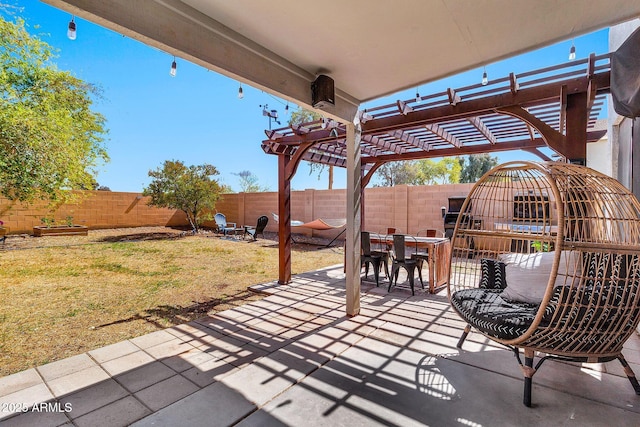 view of patio featuring a fenced backyard, outdoor dining space, and a pergola