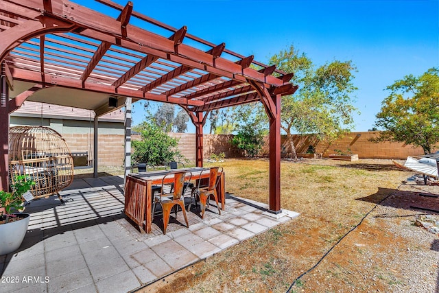 view of patio featuring outdoor dining space, a pergola, and a fenced backyard