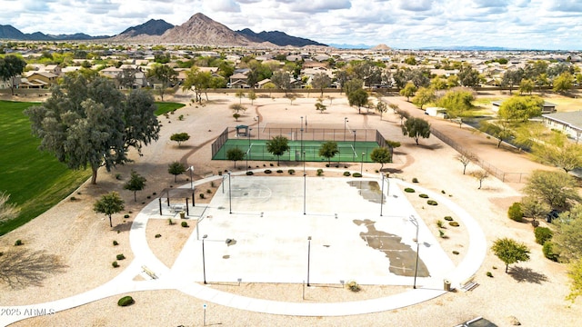 drone / aerial view featuring a residential view and a mountain view