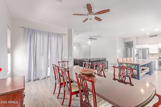 557 S Lemon Ct, Gilbert, AZ 85296 - dining space with ceiling fan and light wood-style flooring