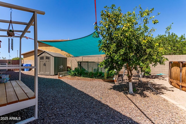557 S Lemon Ct, Gilbert, AZ 85296 - fenced backyard with a storage unit and a wooden deck