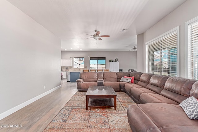 557 S Lemon Ct, Gilbert, AZ 85296 - living area with ceiling fan and light wood-type flooring