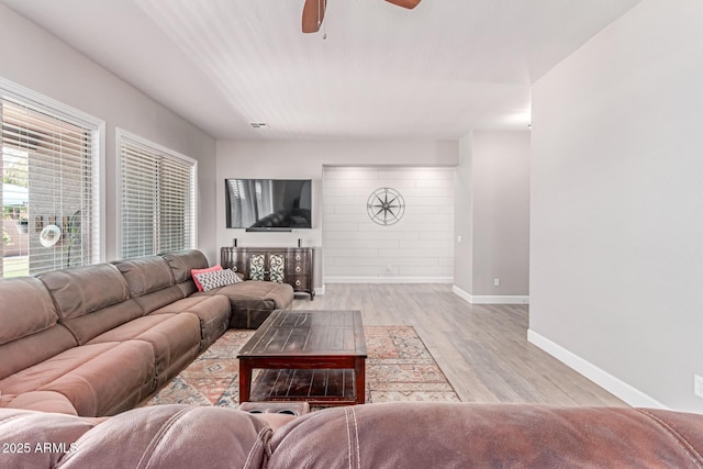557 S Lemon Ct, Gilbert, AZ 85296 - living room featuring a ceiling fan and light wood-style floors