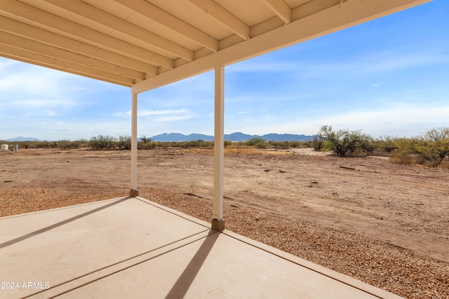 view of patio / terrace featuring a mountain view