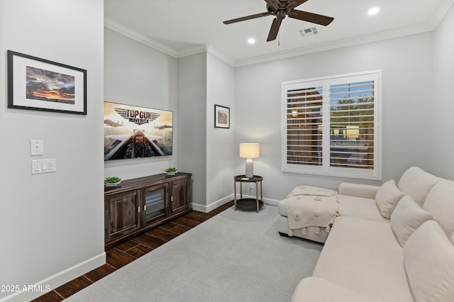 living room featuring ceiling fan and ornamental molding