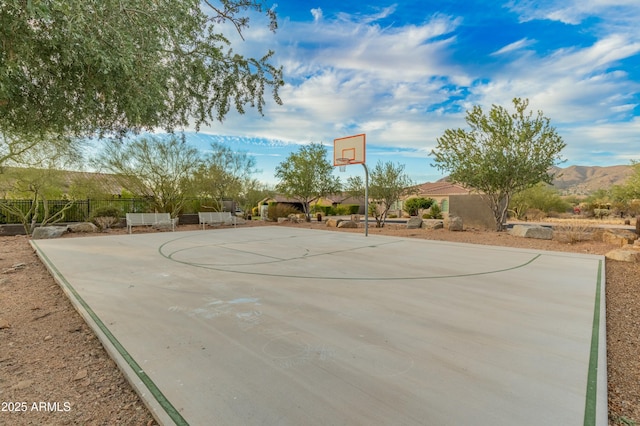 view of sport court with a mountain view