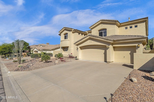 13827 N Mesquite Ln, Fountain Hills, AZ 85268 - mediterranean / spanish home with an attached garage, a tiled roof, driveway, and stucco siding