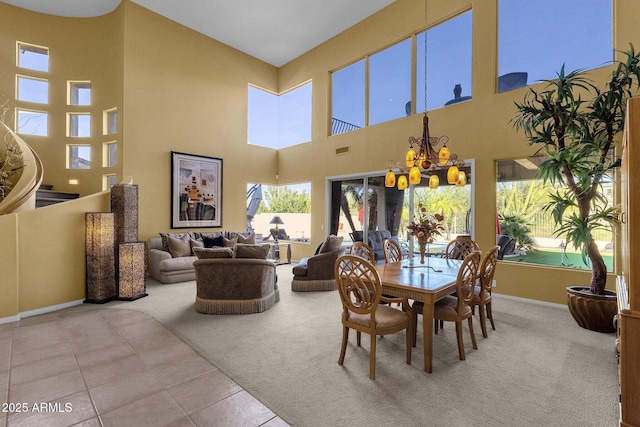 13827 N Mesquite Ln, Fountain Hills, AZ 85268 - dining area with tile patterned floors, a notable chandelier, baseboards, and carpet floors