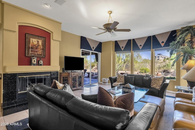 13827 N Mesquite Ln, Fountain Hills, AZ 85268 - tiled living area with a tiled fireplace, visible vents, and a ceiling fan