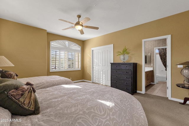13827 N Mesquite Ln, Fountain Hills, AZ 85268 - carpeted bedroom featuring ensuite bath, a closet, baseboards, and a ceiling fan